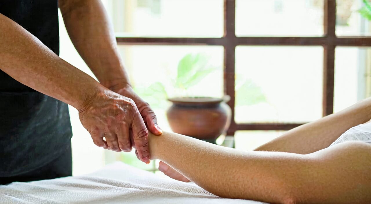 TCM practitioner feeling the pulse, illustrating pattern differentiation consultation