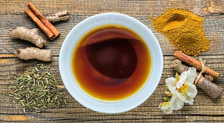 A bowl of kudzu root soup and traditional Chinese medicinal herbs