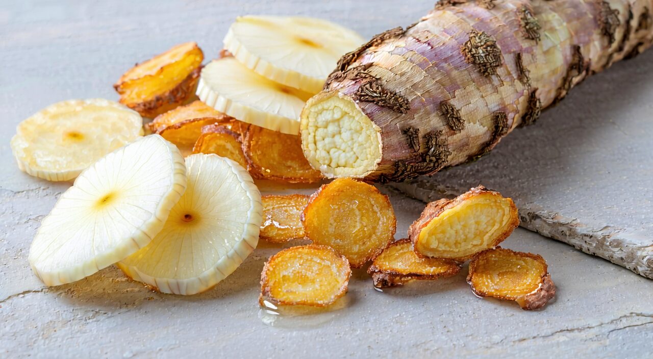 Neat arrangement of white peony slices and honey-fried licorice root under natural light.