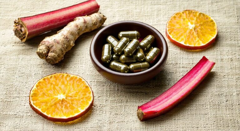 A clean still life composition of Chinese herbal ingredients and pills related to Zhishi Daozhi Wan
